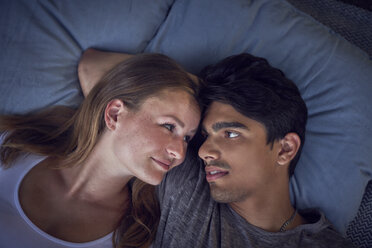 Young couple relaxing on cushions - SRYF00833