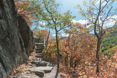 Germany, Rhineland-Palatinate, Rech, Ahr Valley, Red Wine Hiking Trail, rock and stairs in autumn - FRF00733