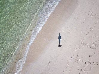 Indonesia, Bali, Aerial view, beach stroll, shadow of person - KNTF01603