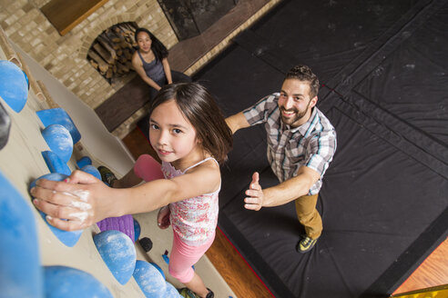 High Angle View Of Family Playing On A Climbing Gym In House - AURF05170