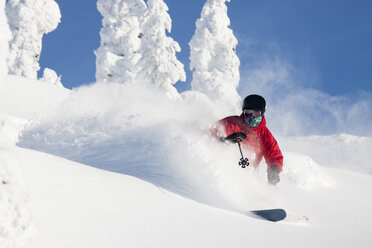 Male Skier Makes A Deep Powder Turn At Whitefish Mountain Resort In Whitefish, Montana - AURF05282