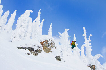 Male Skier Catches Air Off A Cliff At Whitefish Mountain Resort In Montana, Usa - AURF05283