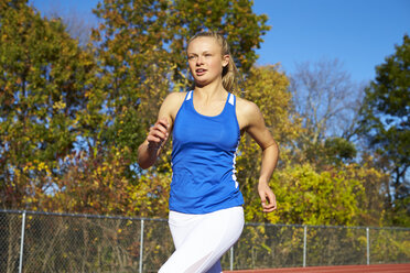 Portrait Of A Female Runner On The Track - AURF05386