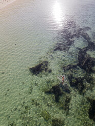 Indonesia, Bali, Aerial view of snorkeler - KNTF01651