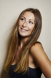 Portrait of freckled young woman with blowing hair - PNEF00871