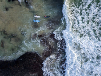 Indonesia, Bali, Aerial view of Dreamland beach, three surfers from above - KNTF01741