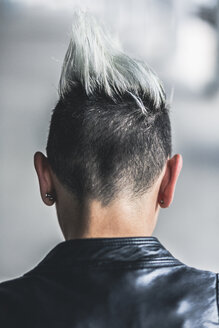 Rear view of punk woman with mohawk haircut - GIOF04410