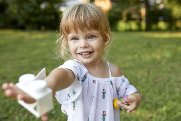 Portrait of cute little girl in garden - ZEDF01549