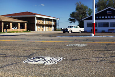 Route 66 logo on the way,classic car in the background - AURF05515