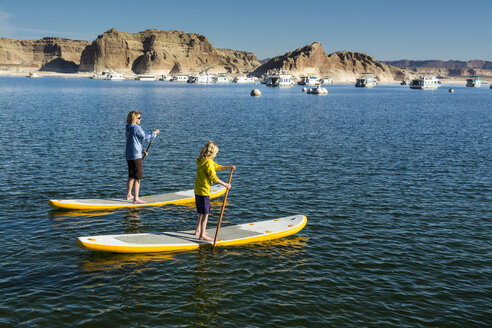 Stand up Paddleboarding on Lake Powell, Glen Caynon National Recreation Area, Page, Arizona. - AURF05593