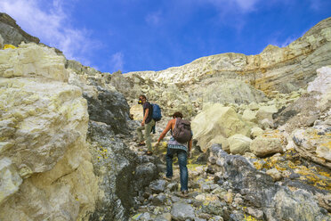 Two Men Hiking In Volcano Kawah Ijen, Java, Indonesia - AURF05689