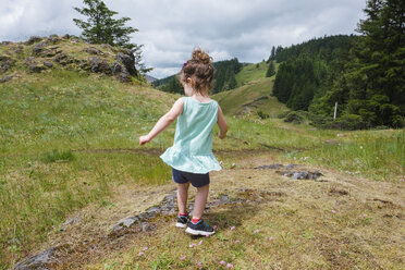 Young child dancing at the top of the Horse Rock Ridge Trail near Eugene Oregon. - AURF05806