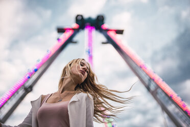 Long-haired young woman on a funfair - KKAF02019