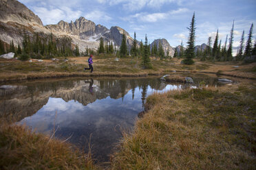 A Woman Trail Running In The Drinnon Pass Area, Canada - AURF05930