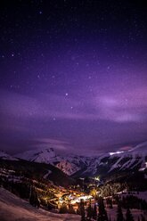 Alpenglow over mountains and town, winter - AURF05953