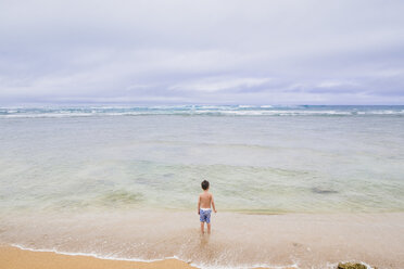 Boy standing on beach - AURF06030