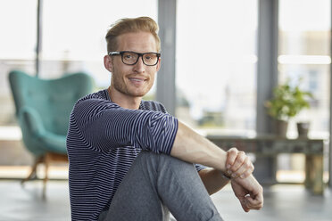 Portrait of smiling young man at home - RBF06833