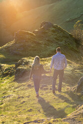 Couple walking holding hands in natural scenery at Horse Rock Ridge, Marcola, Oregon, USA - AURF06175