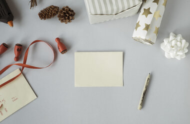 Writing Christmas cards and wrapping Christmas presents - MOMF00503