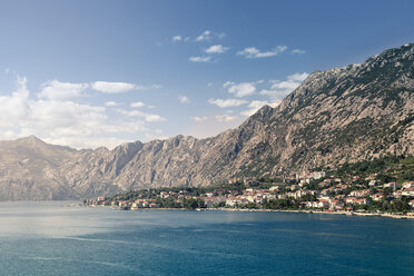 Scenic view of sea against mountains and sky - CAVF48781