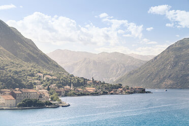 Idyllic view of sea against mountain ranges and sky during sunny day - CAVF48787