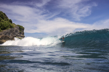 Man surfing on sea against sky at Bali - CAVF48907