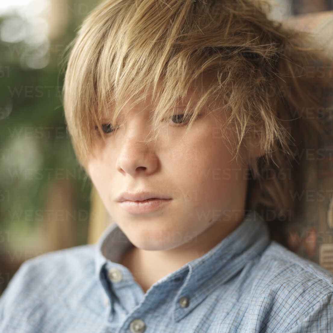 Portrait of tween boy with messy hair stock photo