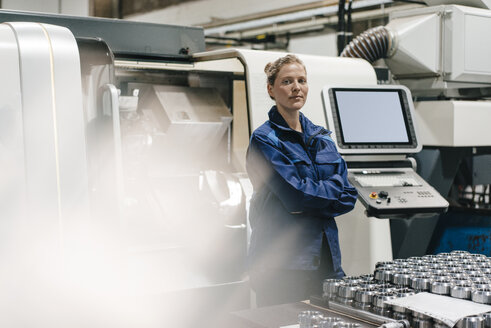 Young woman working as a skilled worker in a high tech company, portrait - KNSF04789