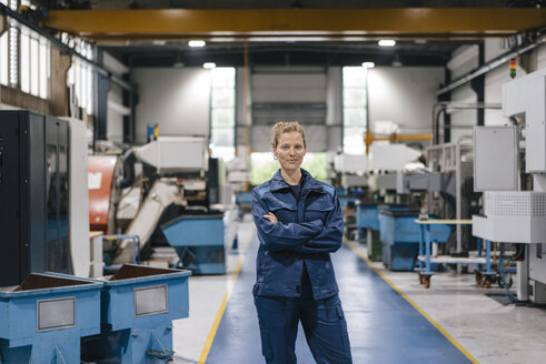 Young woman working as a skilled worker in a high tech company, portrait - KNSF04945