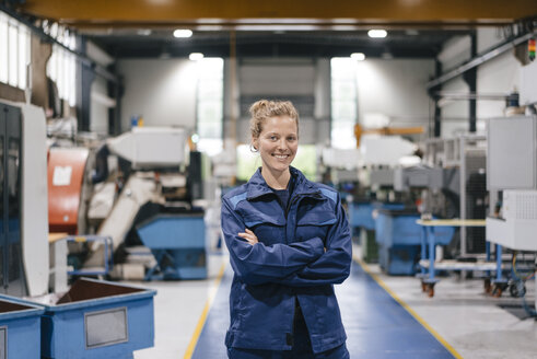 Young woman working as a skilled worker in a high tech company, portrait - KNSF04946