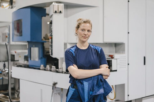 Young woman working as a skilled worker in a high tech company, portrait - KNSF04951