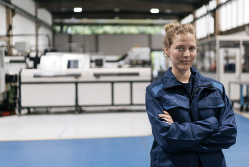 Young woman working as a skilled worker in a high tech company, portrait - KNSF04986