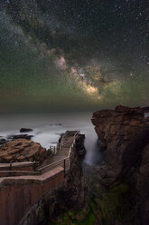 Scenery with Milky Way, footpath and cliffs on coastline at Thunder Hole in Acadia National Park - AURF06410