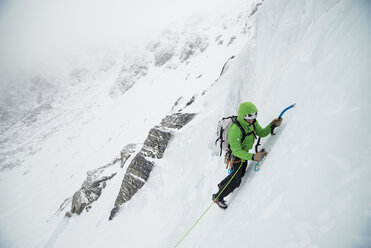 Ice climber leading up into Open Book in Tuckerman Ravine on mount Washington - AURF06450