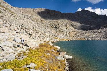 Man hiking by Darwin Basin - AURF06563