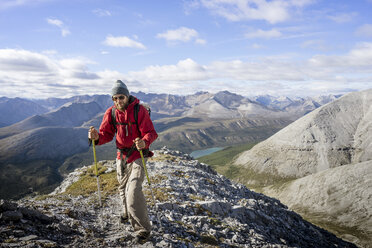 Male hiker Stone Mountain British Columbia in Northern Rockies - AURF06567