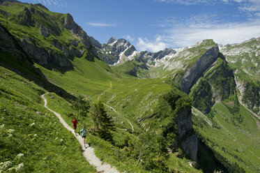 Man and woman hiking in Appenzellerland - AURF06598