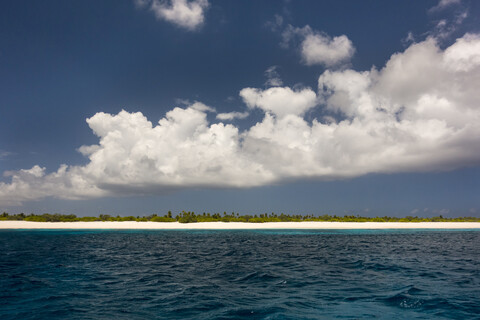 Large clouds over Christmas Island coastline during sunny weather