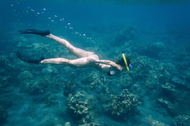 Indonesia, Bali, young woman snorkeling - AURF06977