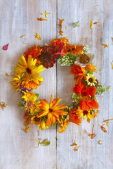 Wreath of colorful flowers on wood - JTF01081
