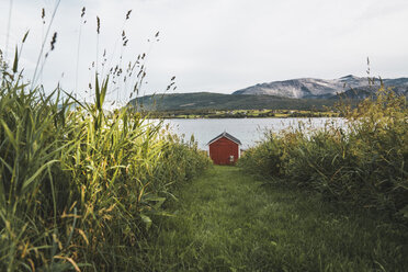 Northern Norway, Lapland, Red wood house at a fjord - KKAF02027