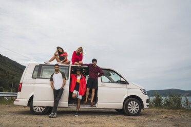 Friends traveling through Norwegian lapland with a camping van - KKAF02052