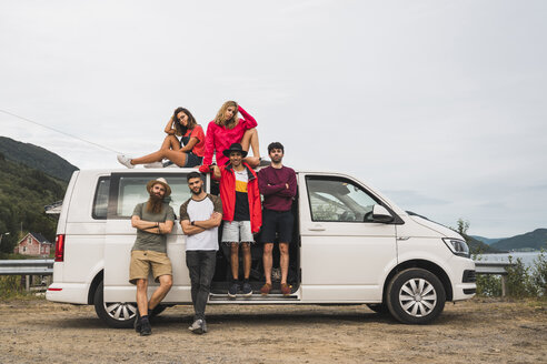 Friends traveling through Norwegian lapland with a camping van - KKAF02055