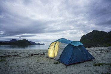Norway, Lapland, Tent on a beach at fjord - KKAF02066