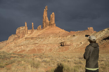 Person photographing Moses rock tower, Moab, Utah, USA - AURF07246