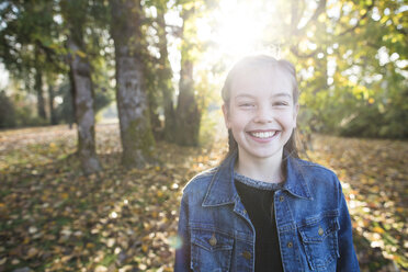 Portrait of smiling girl in park - AURF07259