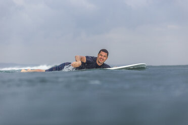 Surfer paddling on the sea - AURF07345