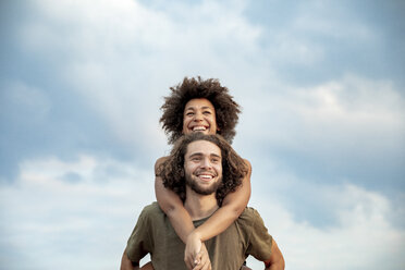 Portrait of happy carefree couple outdoors - FMKF05268