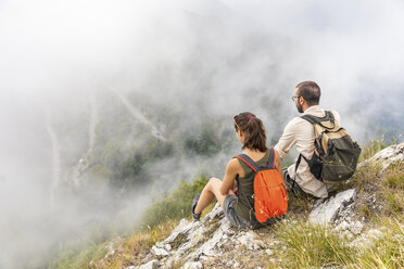 Italy, Massa, couple looking at the beautiful view in the Alpi Apuane - WPEF00865