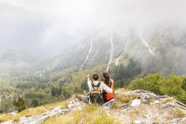 Italy, Massa, couple looking at the beautiful view in the Alpi Apuane - WPEF00866